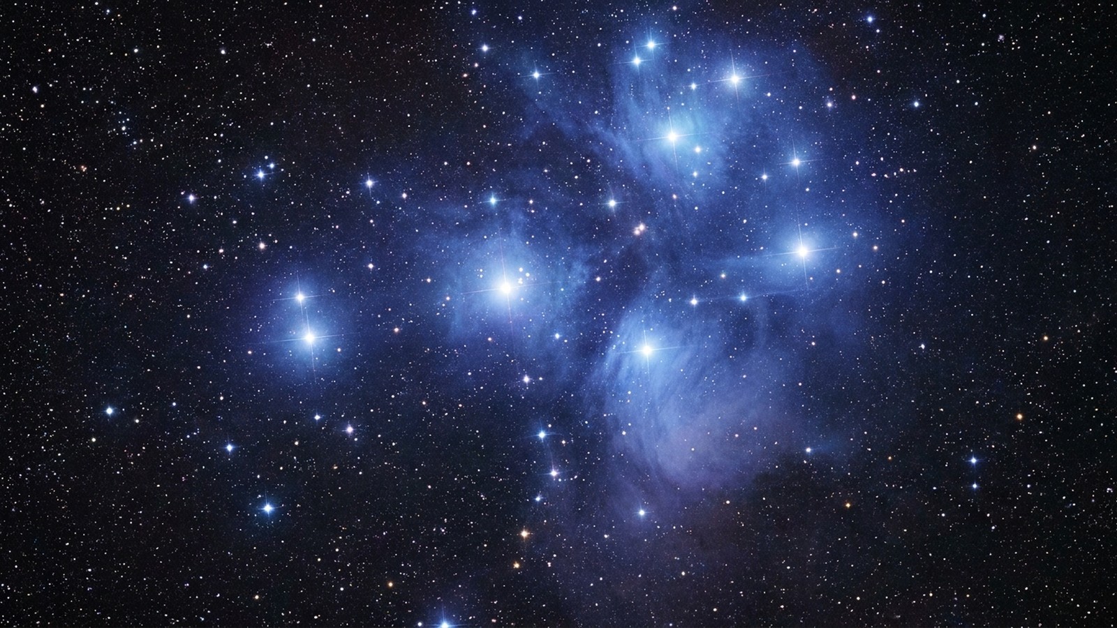 Un ciel étoilé profond avec une grande nébuleuse colorée bleue et violette, étoiles scintillantes et immensité cosmique silencieuse